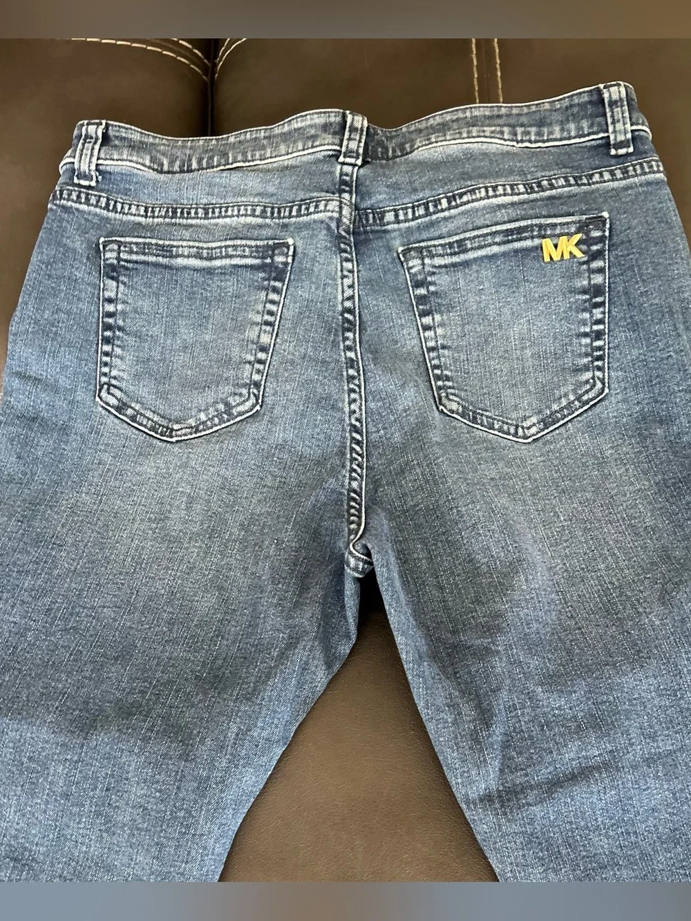 Michael Kors Medium Wash Slim Leg Jeans with Gold MK Logo